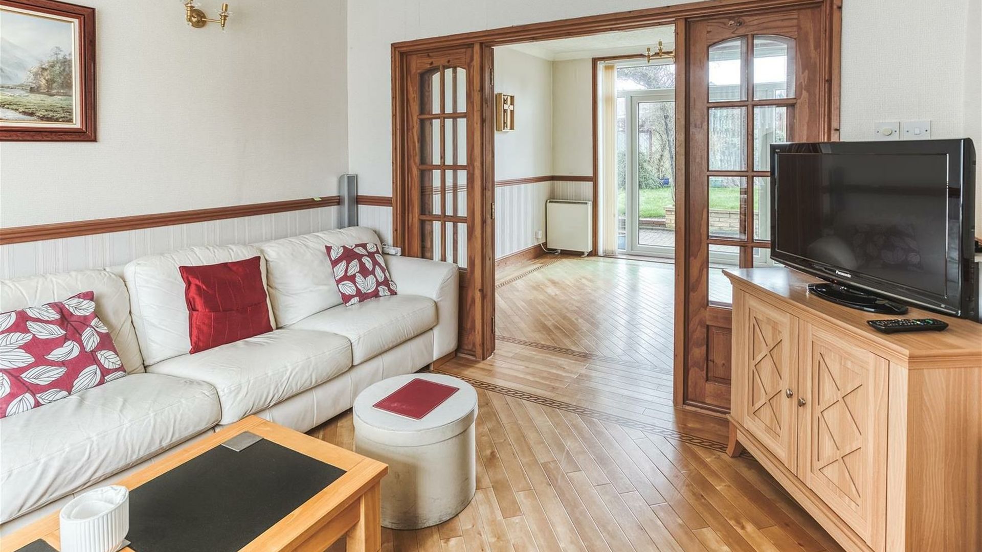 Lounge before, looking through the double doors